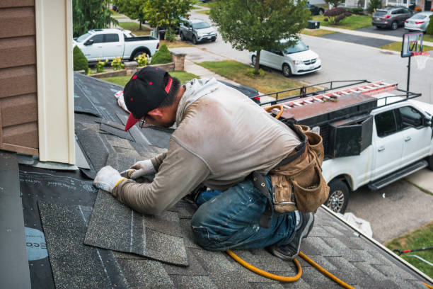 Professional Roof Replacement technician working in Ludington, MI